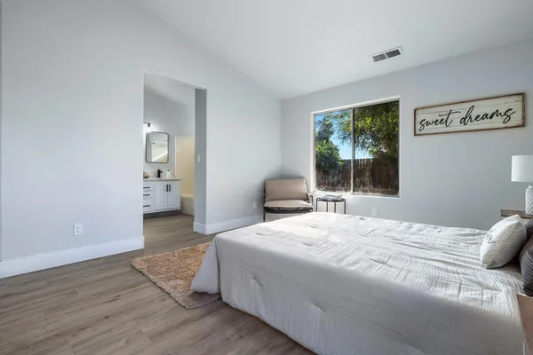 a bedroom with a bed and a window