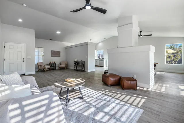 a living room with furniture and a rug