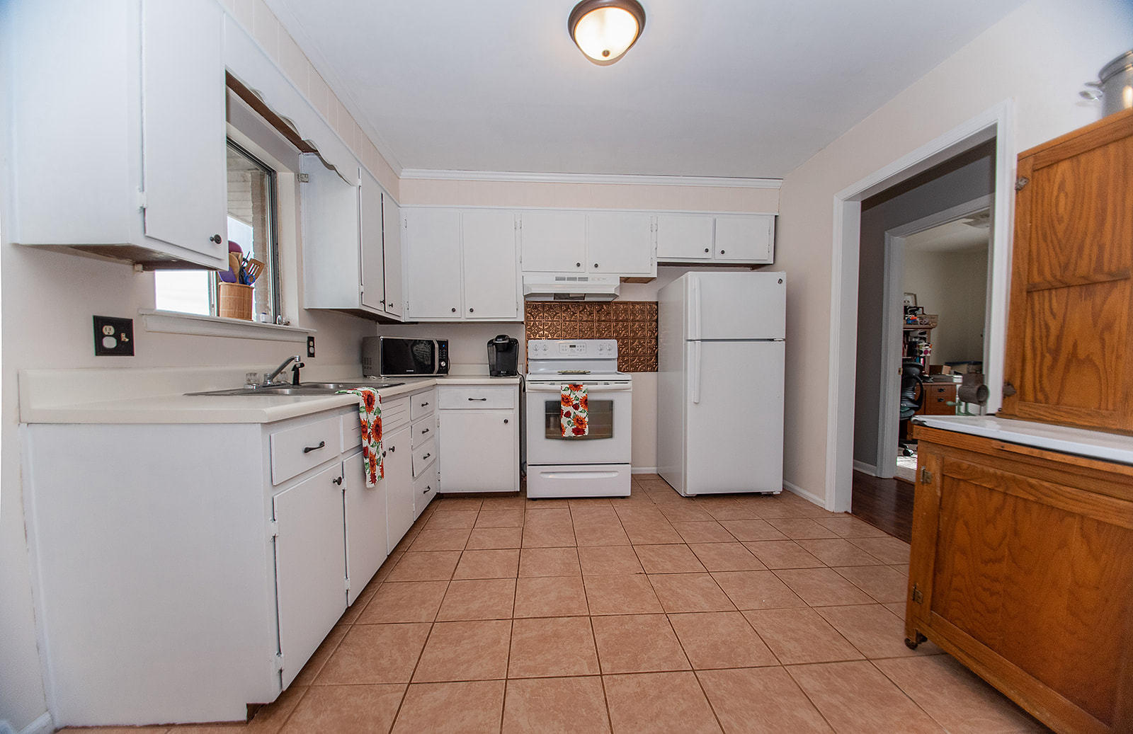 549 Holiday Road Vinton, VA 24179 - Photo 20 of 30 a kitchen with a refrigerator sink and cabinets