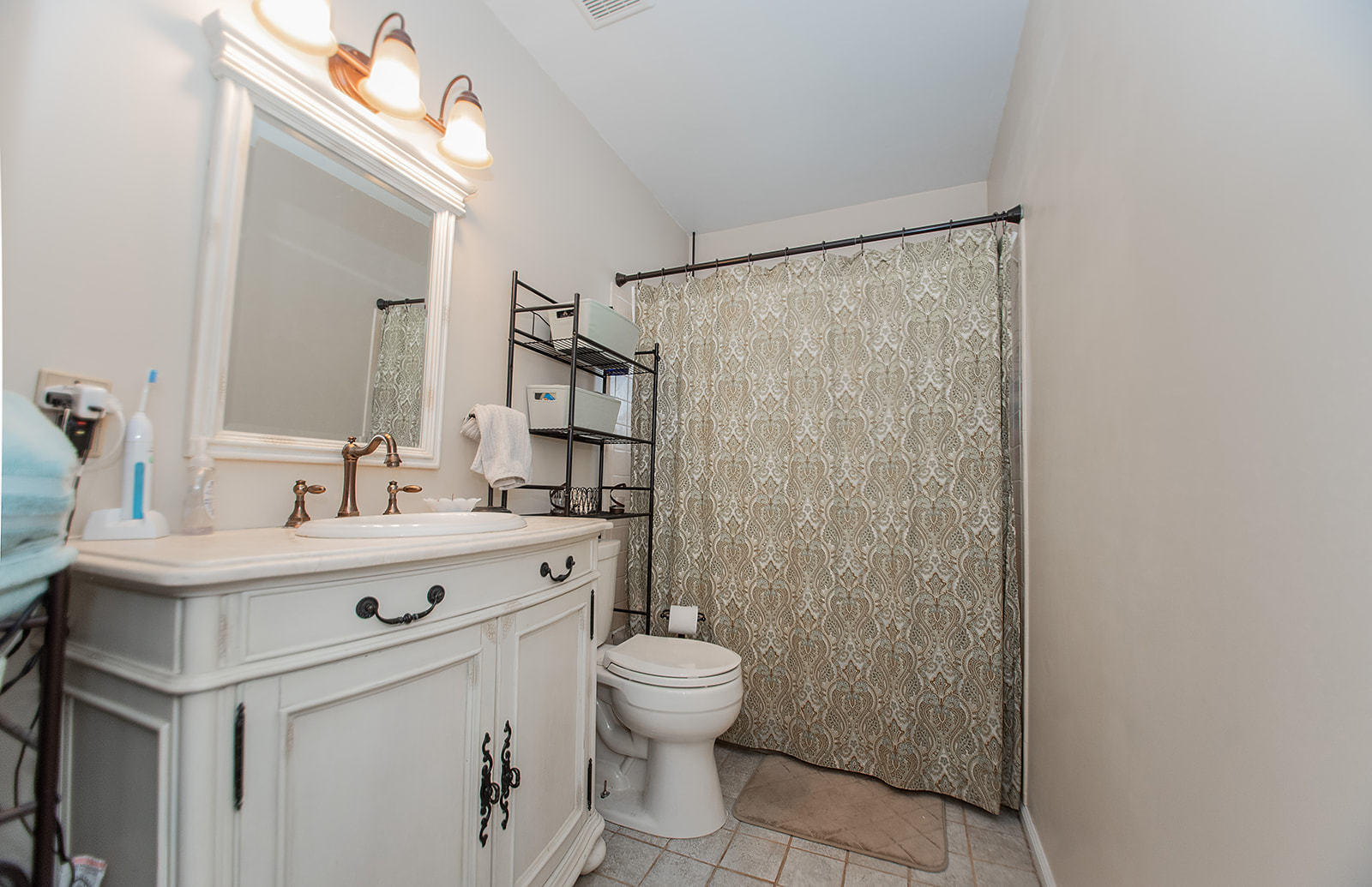 549 Holiday Road Vinton, VA 24179 - Photo 28 of 30 a bathroom with a sink a toilet a mirror and shower