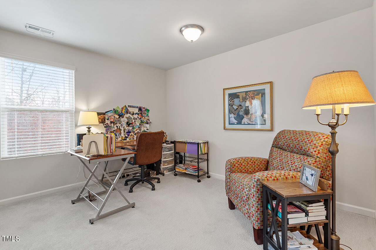 1157 Chestnut Bluff Apex, NC 27502 - Photo 20 of 42 a view of a workspace with furniture and a window