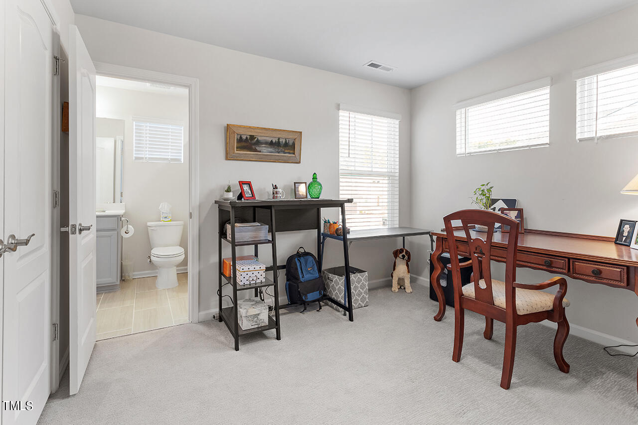 1157 Chestnut Bluff Apex, NC 27502 - Photo 28 of 42 a view of a workspace with furniture and a window