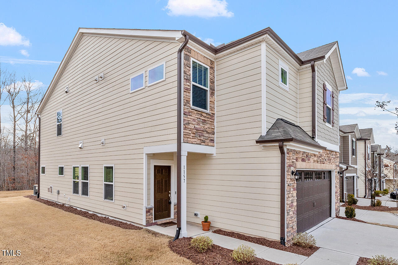 1157 Chestnut Bluff Apex, NC 27502 - Photo 3 of 42 a view of a house with a small space
