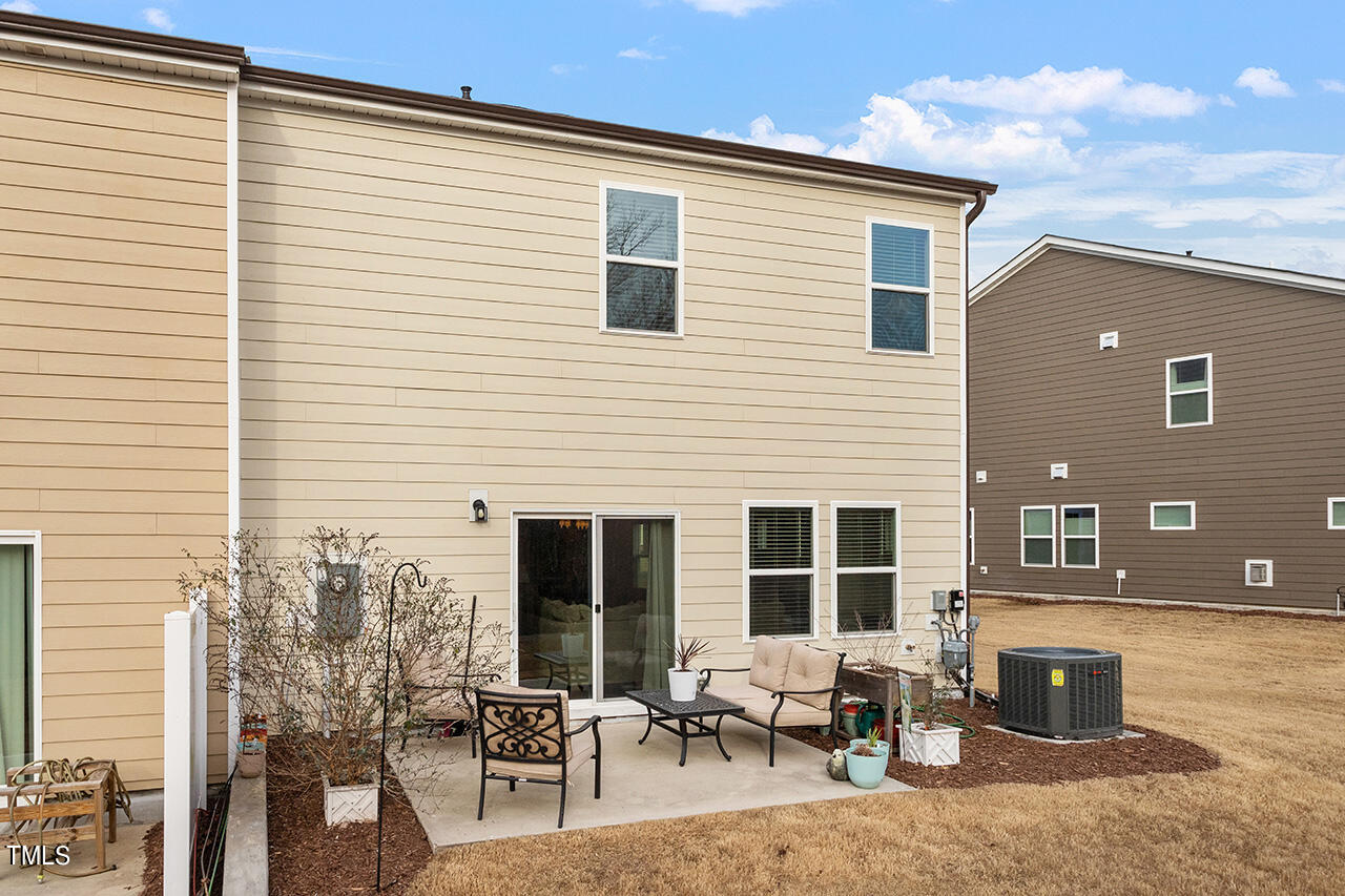 1157 Chestnut Bluff Apex, NC 27502 - Photo 32 of 42 a backyard of a house with outdoor seating