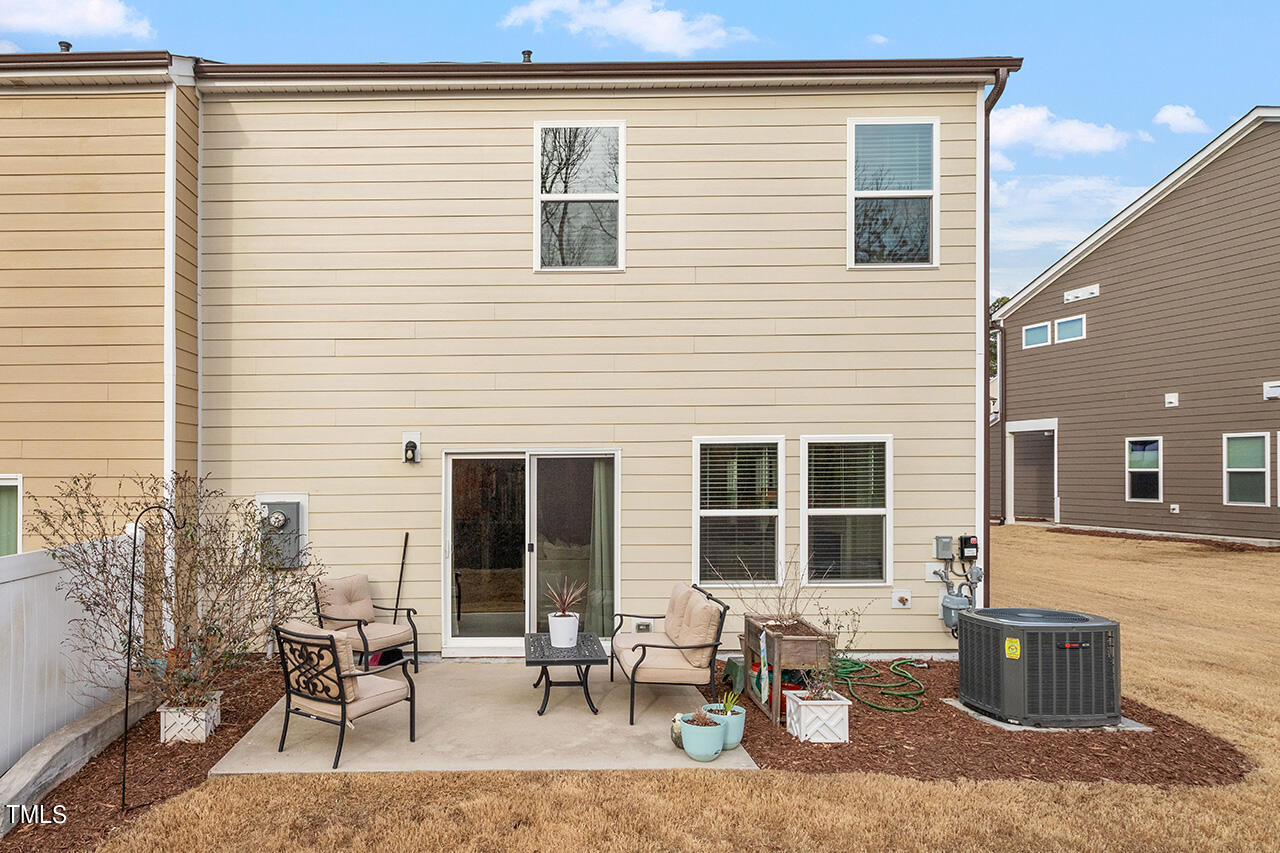 1157 Chestnut Bluff Apex, NC 27502 - Photo 33 of 42 a building outdoor space with patio furniture