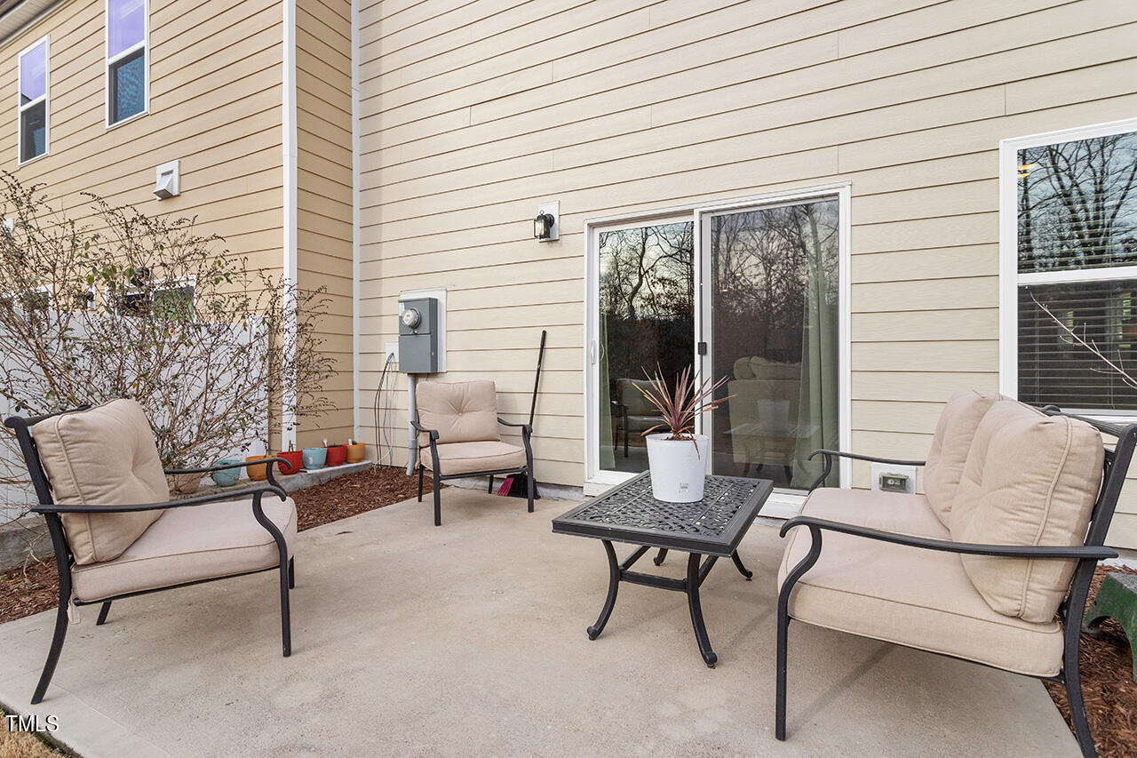 1157 Chestnut Bluff Apex, NC 27502 - Photo 34 of 42 a view of a house with backyard and sitting area