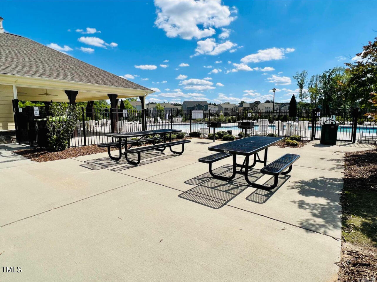 1157 Chestnut Bluff Apex, NC 27502 - Photo 38 of 42 a living room with patio furniture and a potted plant
