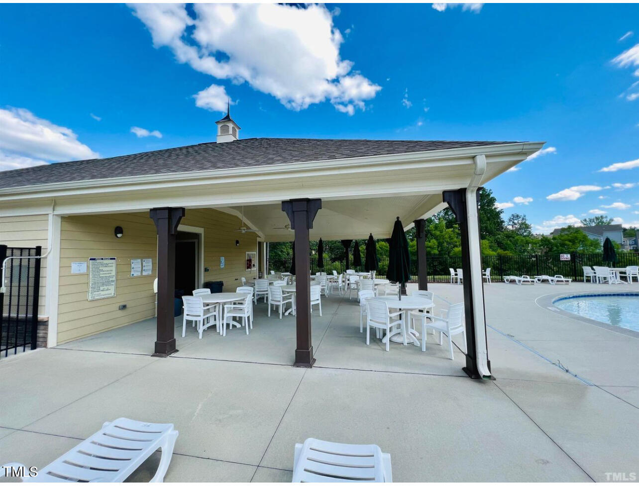 1157 Chestnut Bluff Apex, NC 27502 - Photo 39 of 42 a view of a patio with dining table and chairs