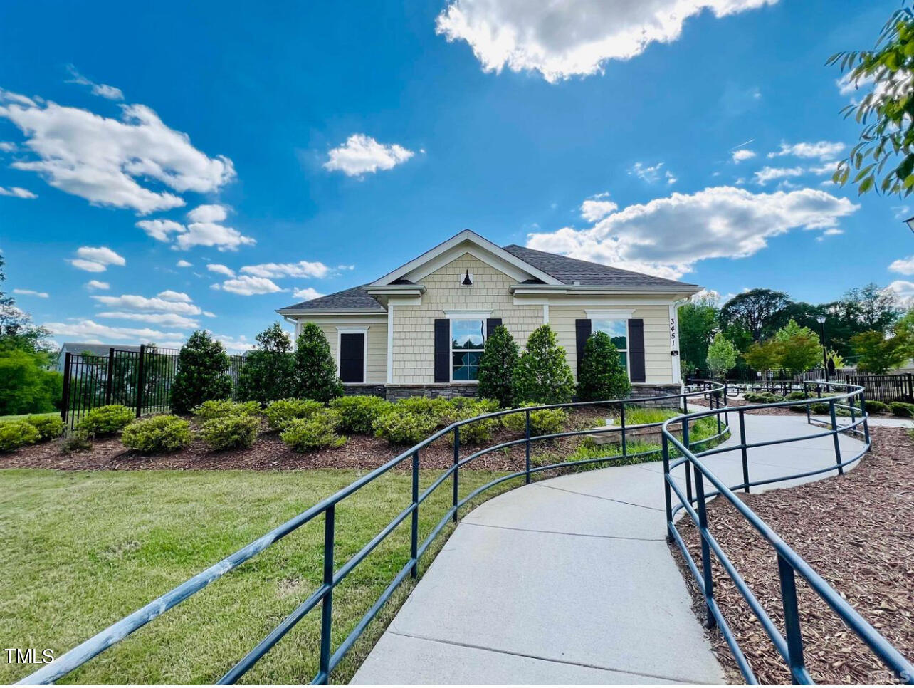 1157 Chestnut Bluff Apex, NC 27502 - Photo 40 of 42 a view of house with garden and a sitting area