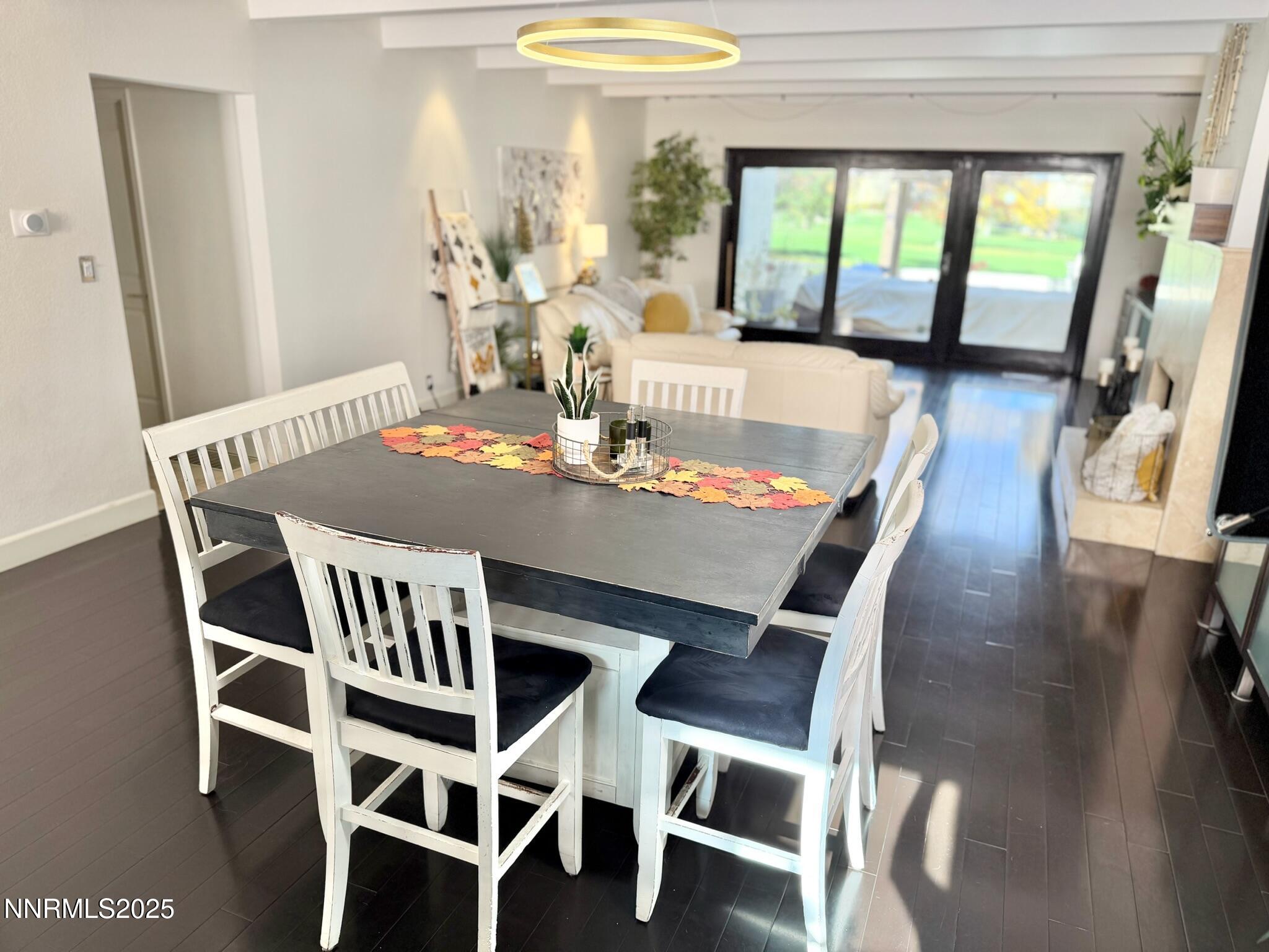 5012 Lakeridge Terrace East Reno, NV 89509 - Photo 12 of 49 a view of a dining room with furniture window and wooden floor