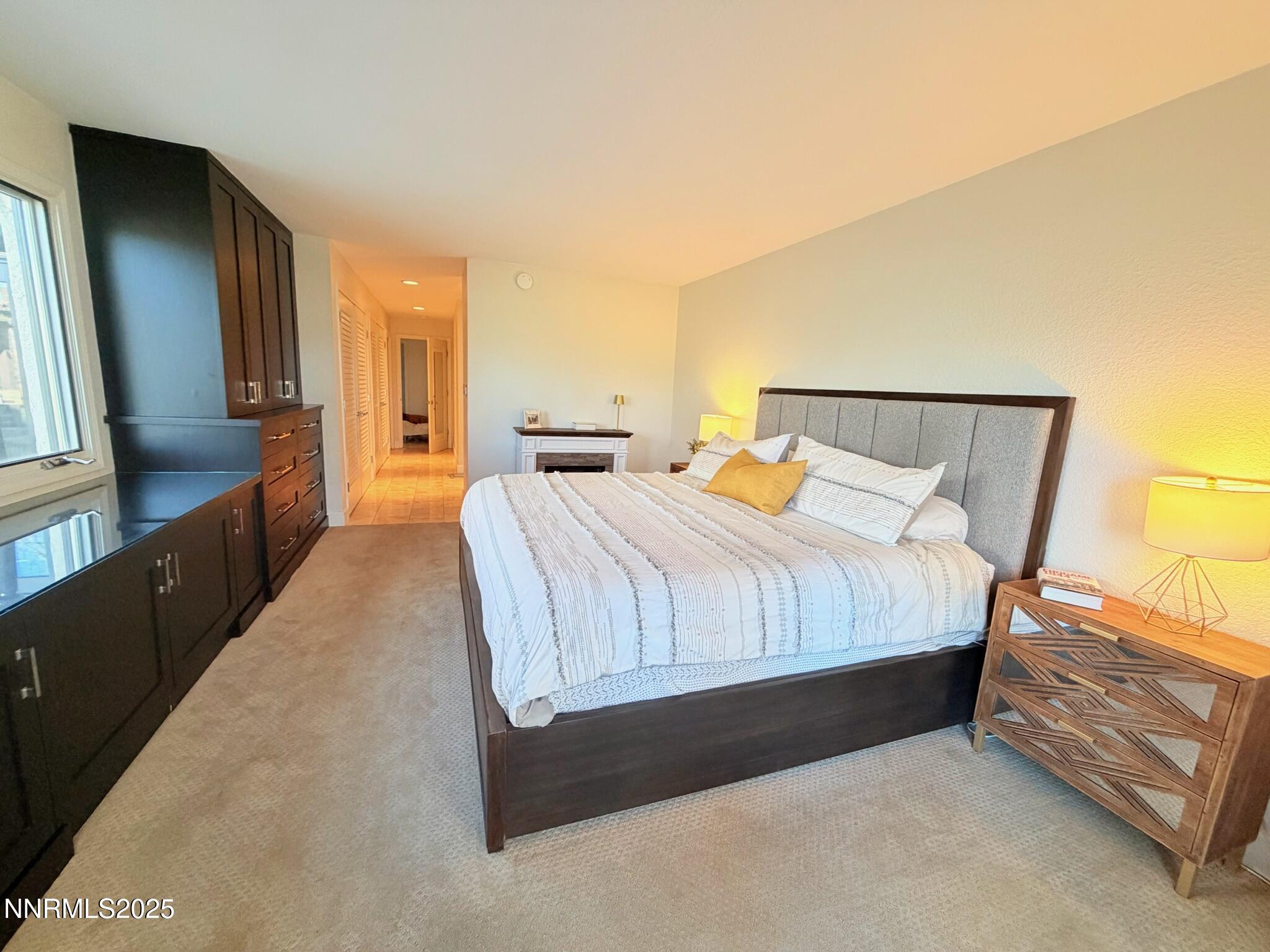 5012 Lakeridge Terrace East Reno, NV 89509 - Photo 18 of 49 a bedroom with a bed and wooden floor