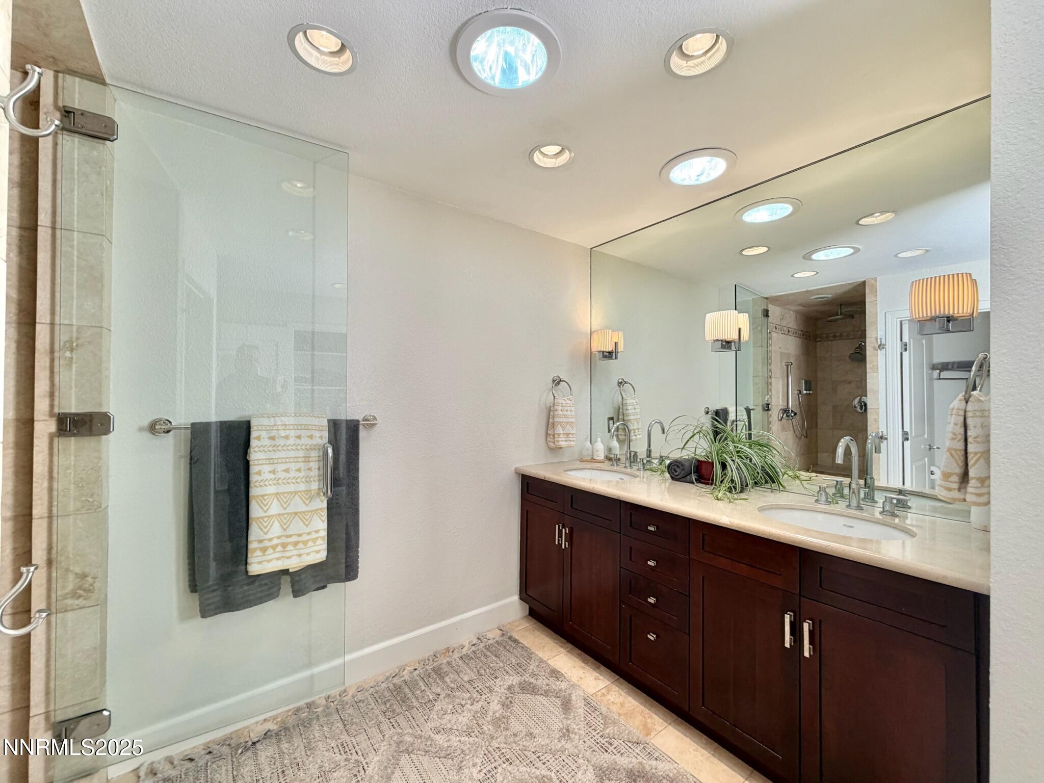 5012 Lakeridge Terrace East Reno, NV 89509 - Photo 23 of 49 a bathroom with a double vanity sink and a mirror