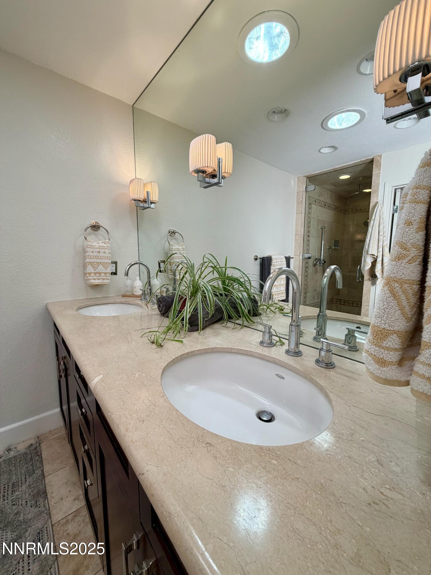 5012 Lakeridge Terrace East Reno, NV 89509 - Photo 24 of 49 a bathroom with a granite countertop sink a mirror and vanity
