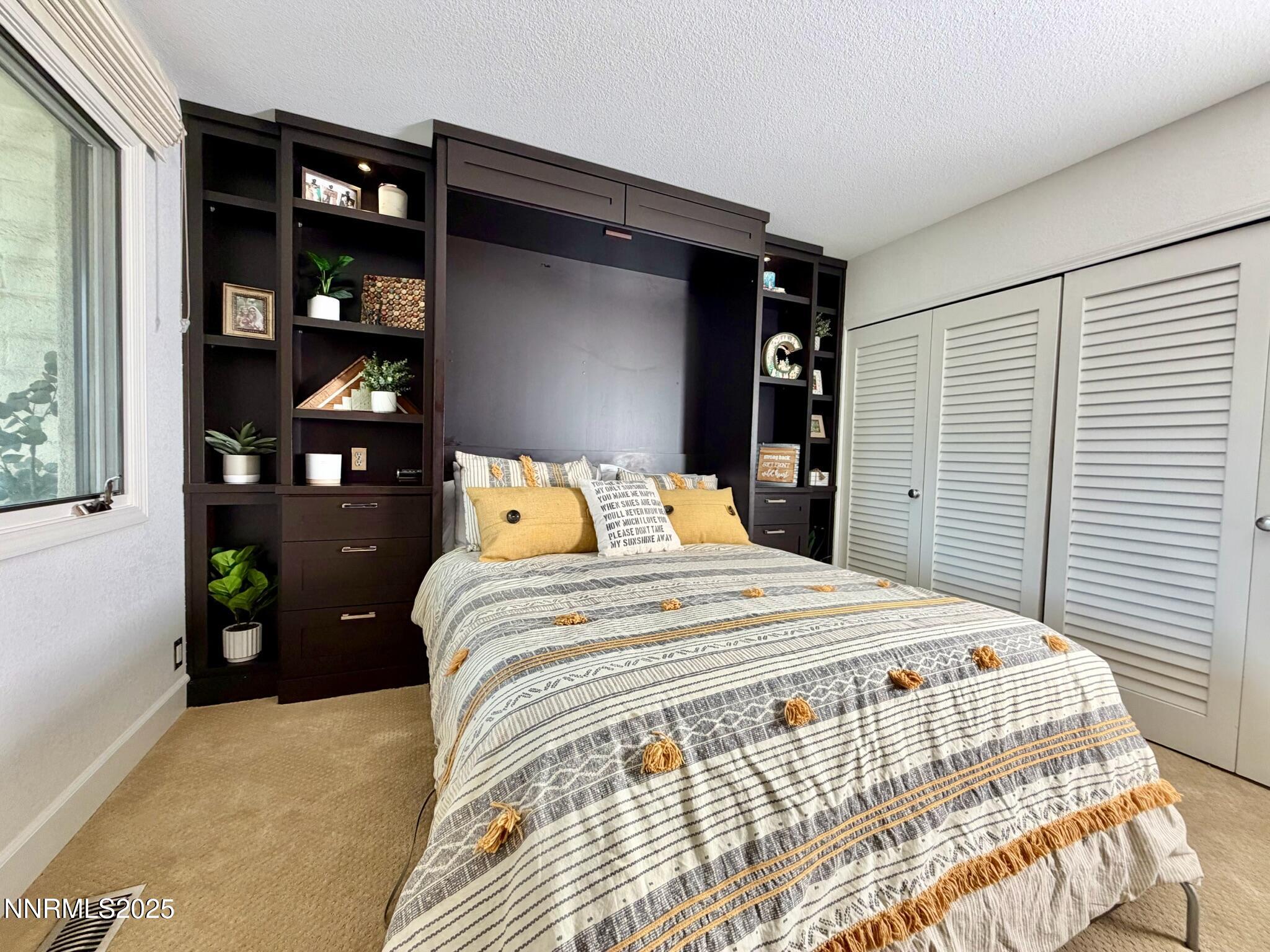 5012 Lakeridge Terrace East Reno, NV 89509 - Photo 27 of 49 a bedroom with a bed and walk in closet