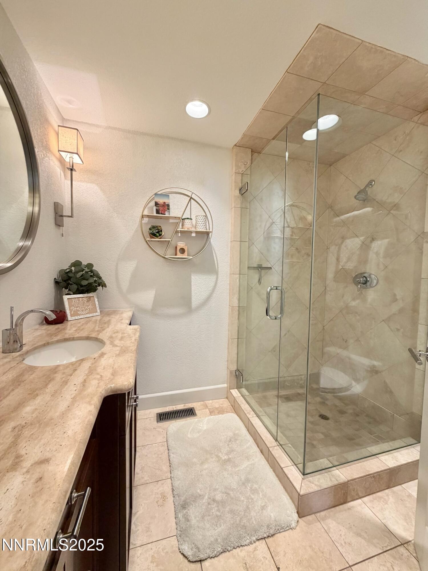 5012 Lakeridge Terrace East Reno, NV 89509 - Photo 30 of 49 a bathroom with a granite countertop sink a mirror and shower