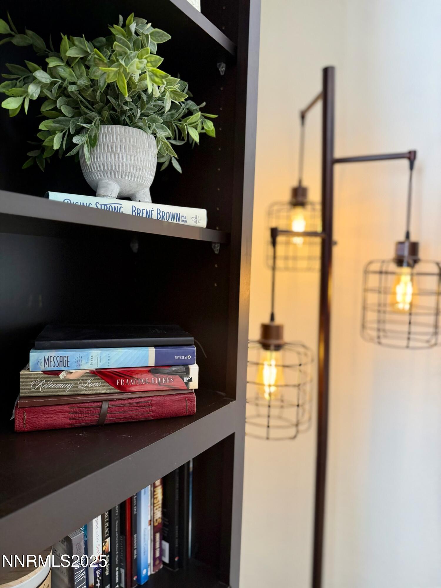 5012 Lakeridge Terrace East Reno, NV 89509 - Photo 34 of 49 a vase of flowers sitting on a table with a book shelf