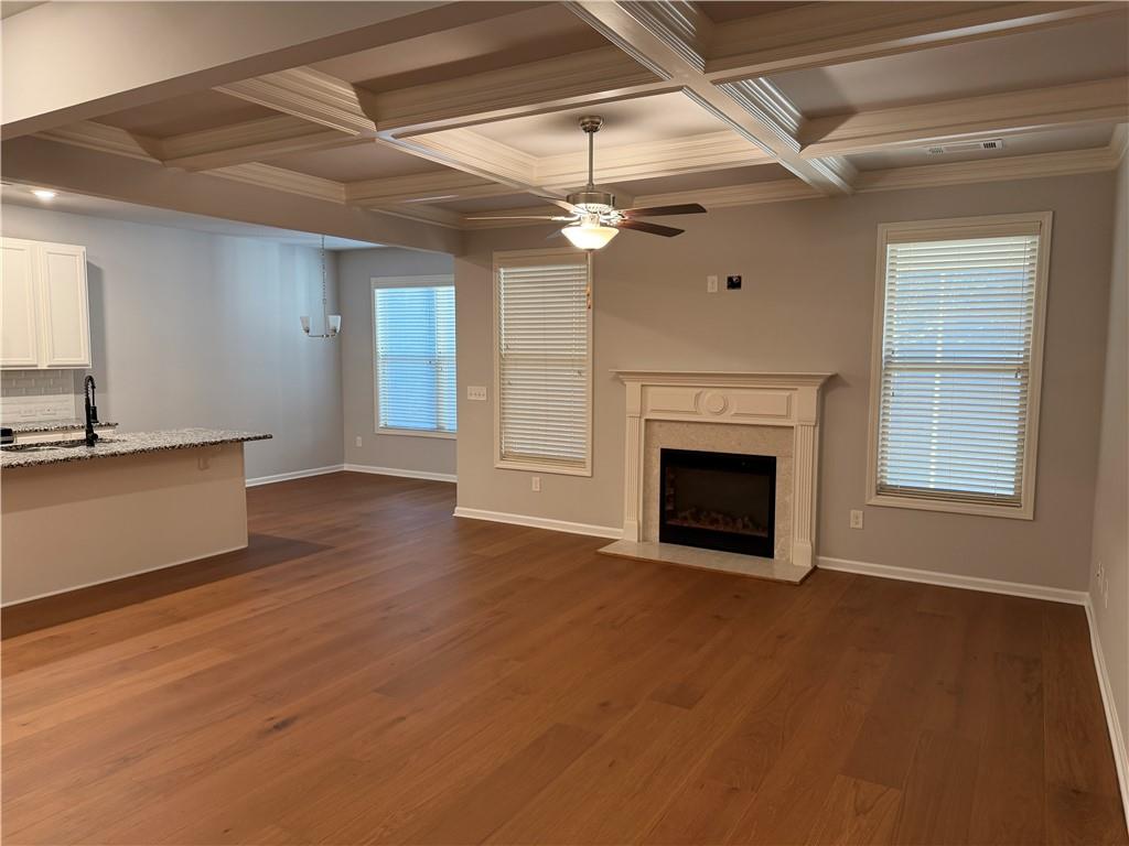 7811 Silk Tree Pointe Braselton, GA 30517 - Photo 4 of 20 a view of a livingroom with a fireplace and window