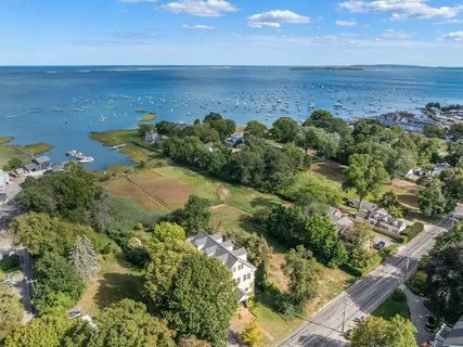 an aerial view of a houses with a yard