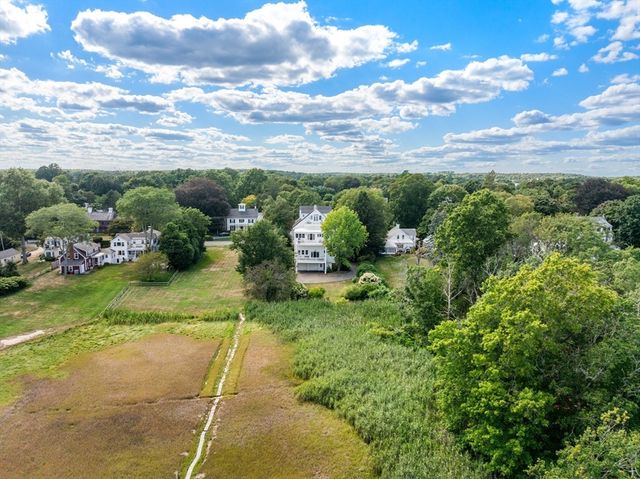 a view of a garden with lawn chairs