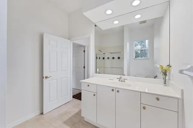 a living room with lots of furniture and a large window