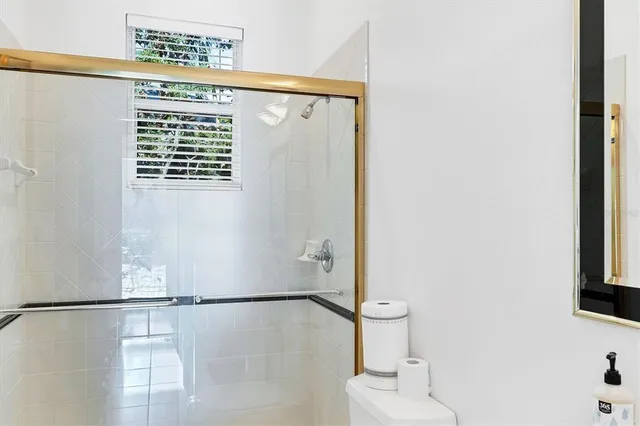 a view of a chairs and table on the patio