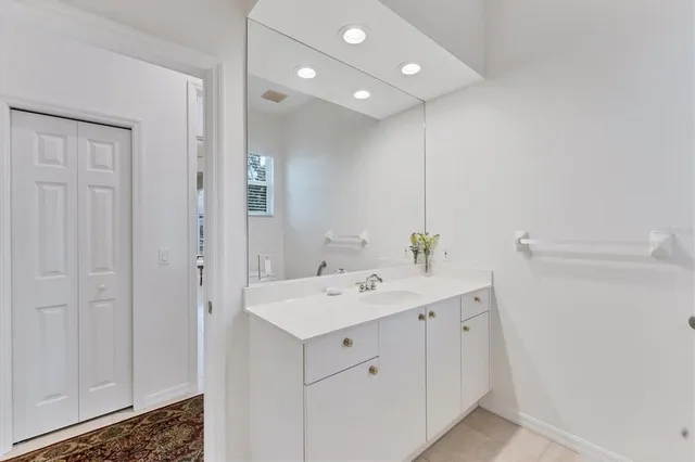 an aerial view of a residential houses with outdoor space and lake view