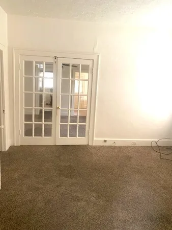 a view of an empty room with a window