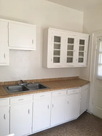 a view of a kitchen with cabinets