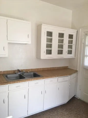 a view of a kitchen with cabinets