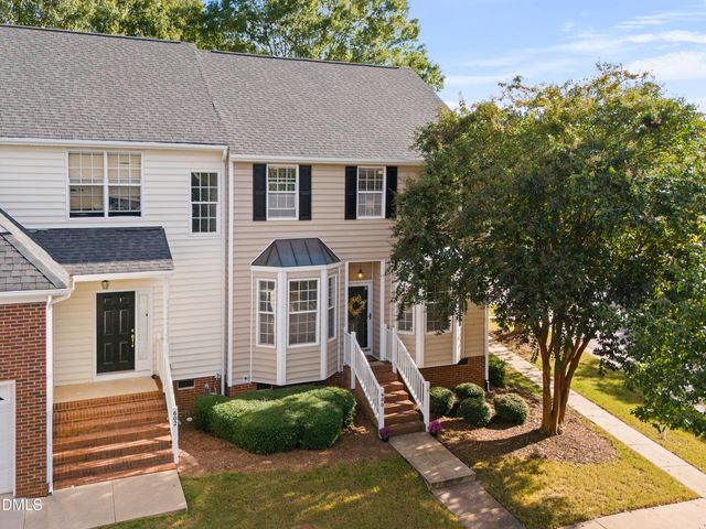 a view of a patio with table and chairs and potted plants