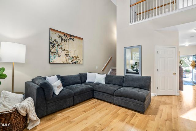 a kitchen with a window and wooden cabinets
