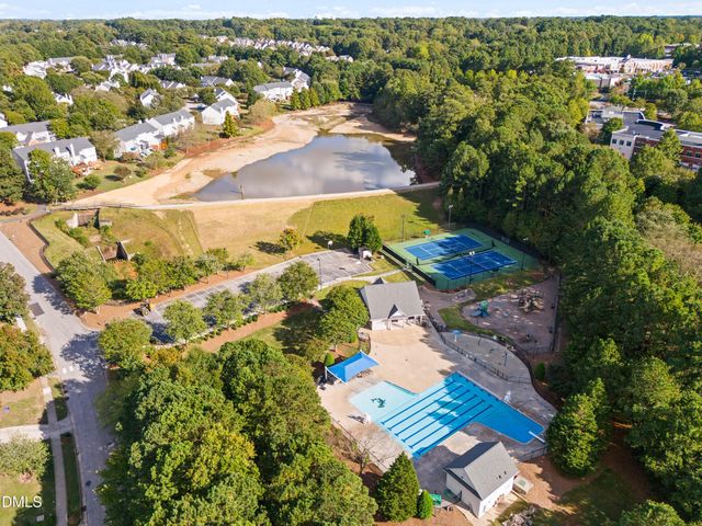 a room with a bed and a book shelf