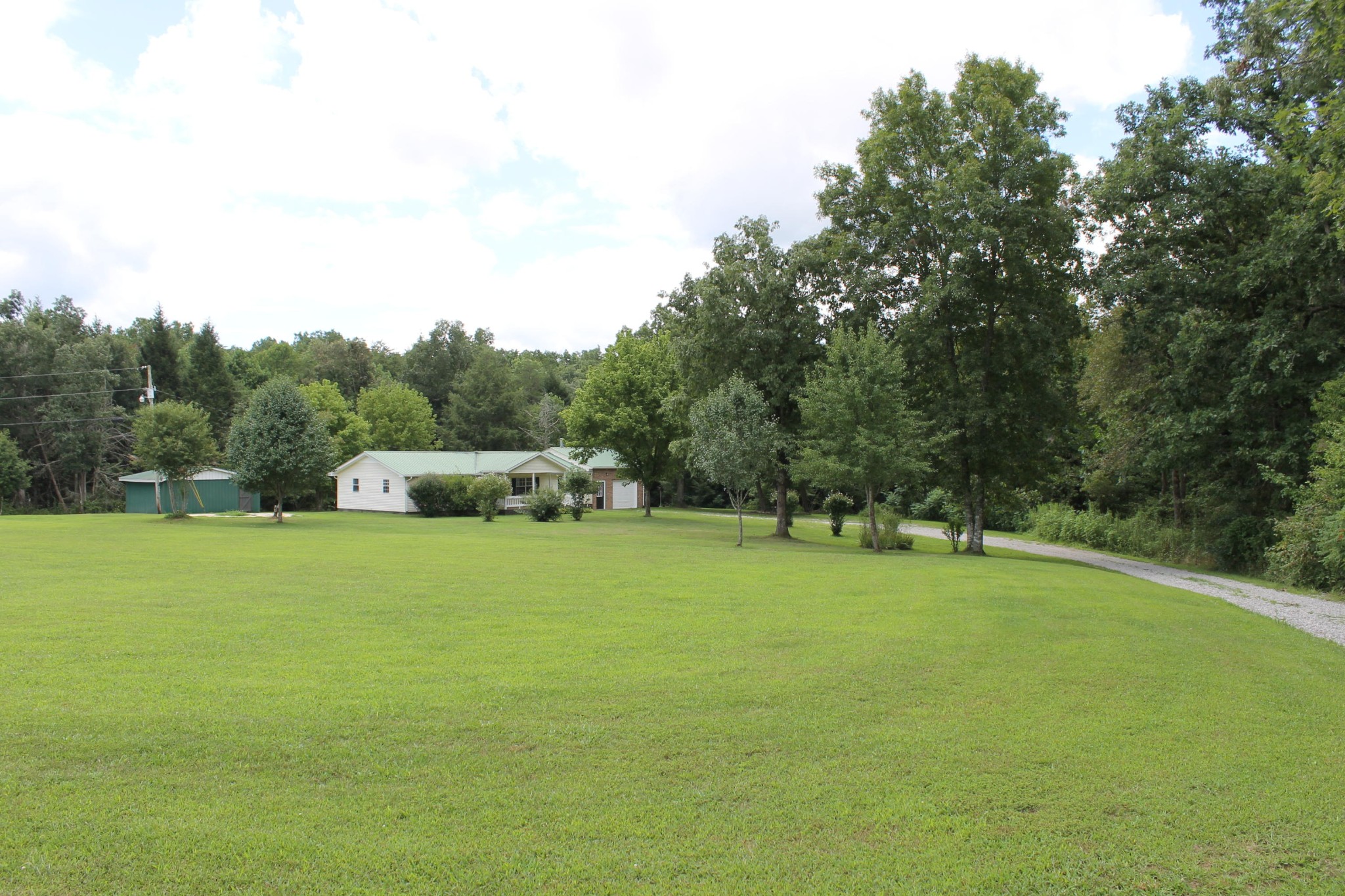 1326 Virgil Beaty Road Clarkrange, TN 38553 - Photo 1 of 26 a front view of a house with a yard