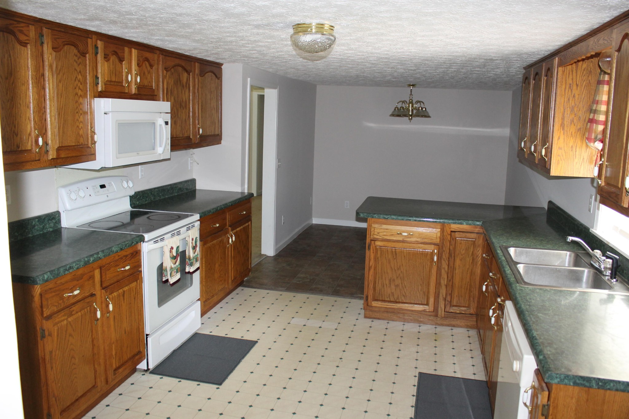 1326 Virgil Beaty Road Clarkrange, TN 38553 - Photo 10 of 26 a kitchen with a sink and a stove top oven