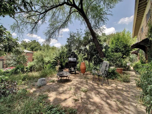 a view of balcony with wooden floor and fence