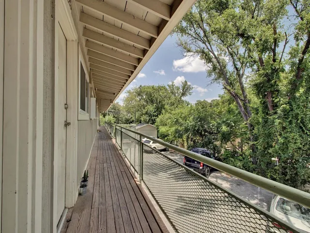 a front view of a house with basket ball court and outdoor seating