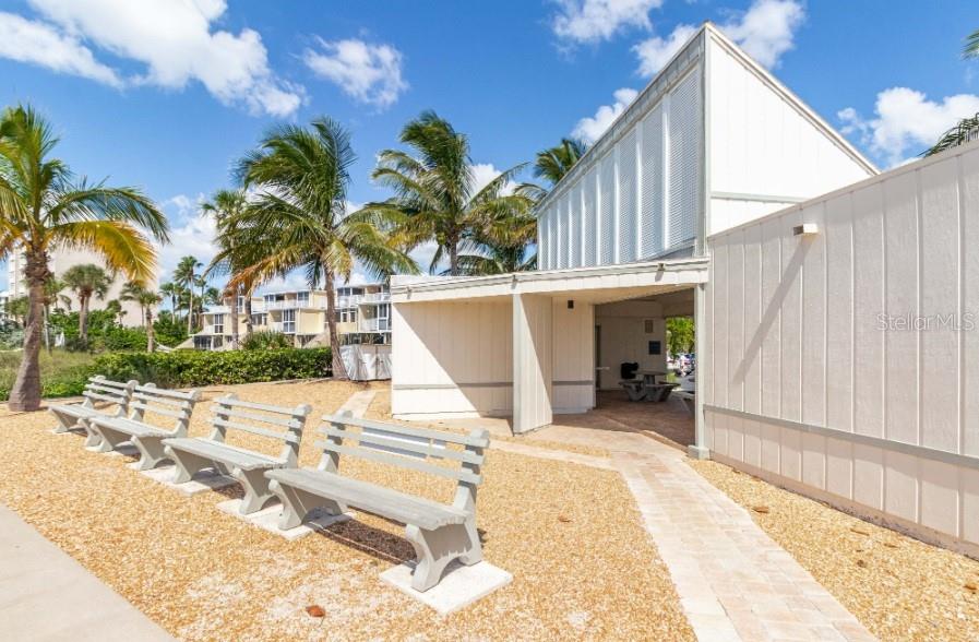 605 Sutton Place, Unit 102 Longboat Key, FL 34228 - Photo 26 of 29 a view of a house with backyard and sitting area