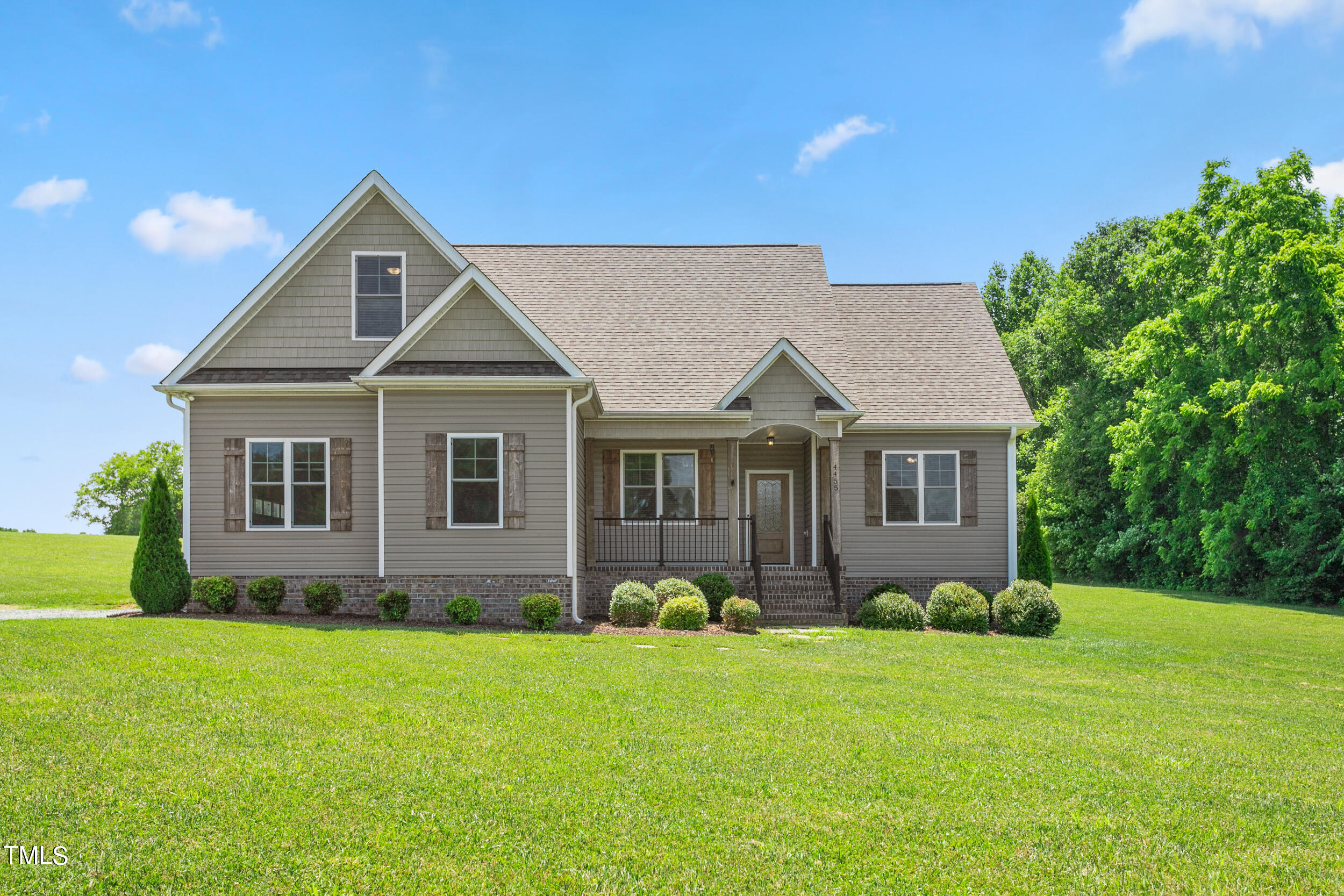 4455 Boyd Wright Road Burlington, NC 27215 - Photo 1 of 40 a front view of a house with garden