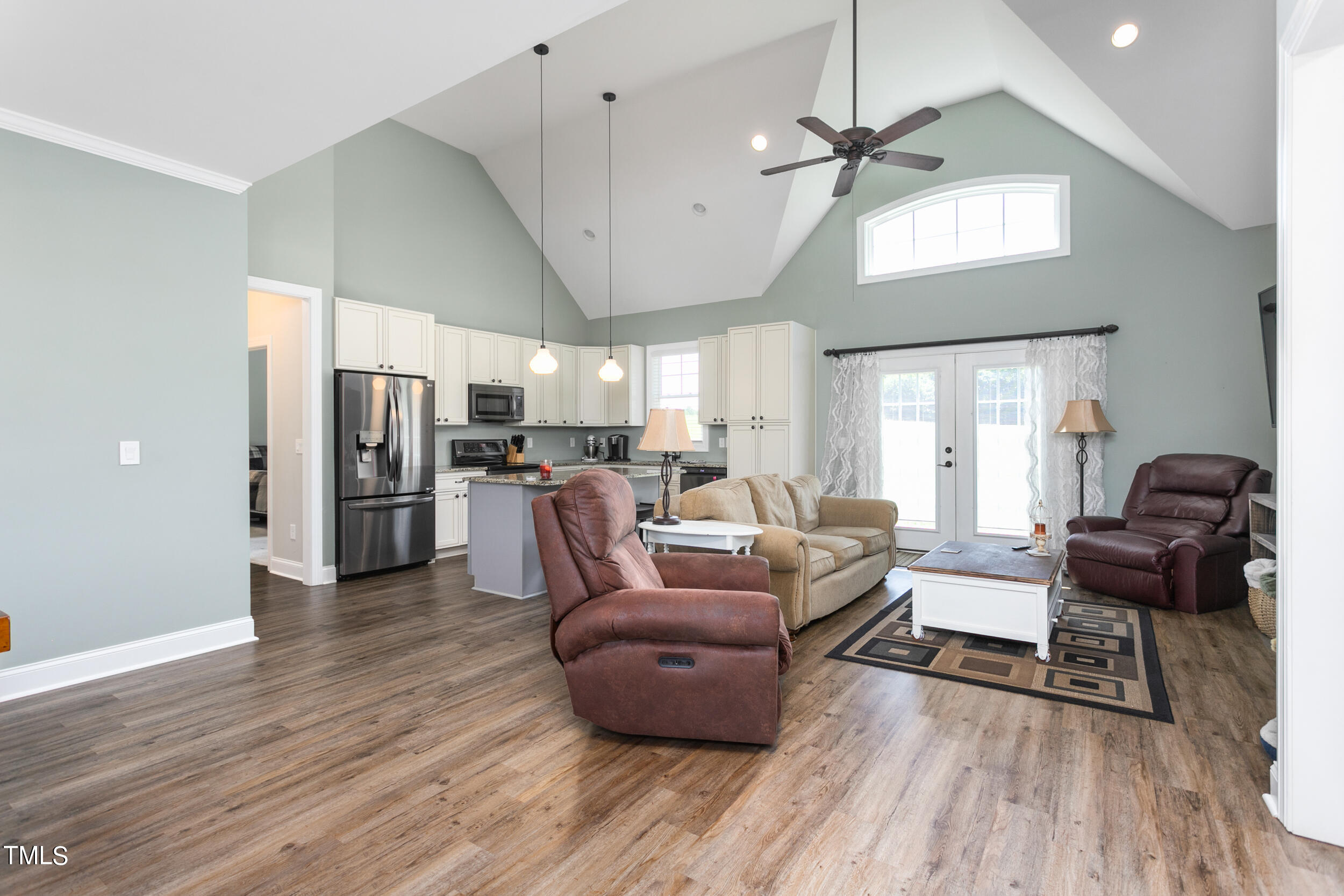 4455 Boyd Wright Road Burlington, NC 27215 - Photo 11 of 40 a living room with furniture kitchen and a wooden floor