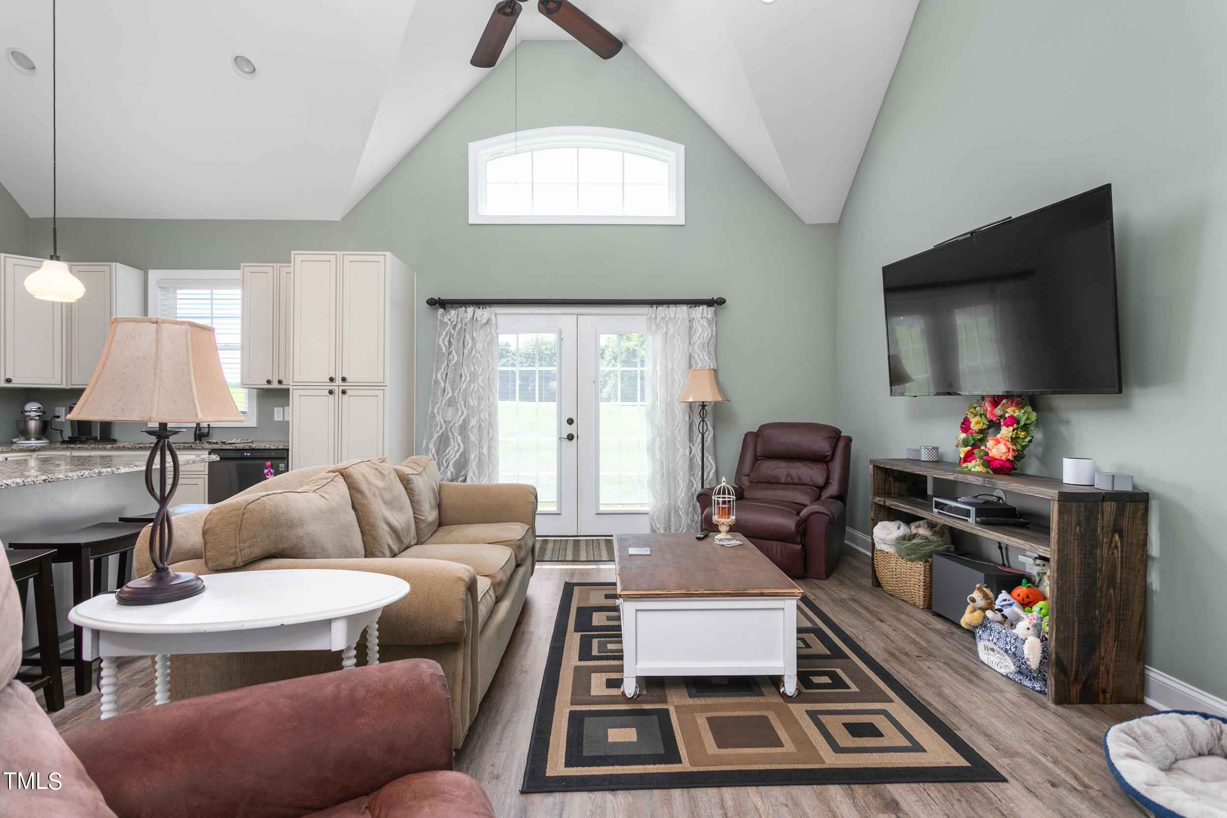 4455 Boyd Wright Road Burlington, NC 27215 - Photo 12 of 40 a living room with furniture and a flat screen tv