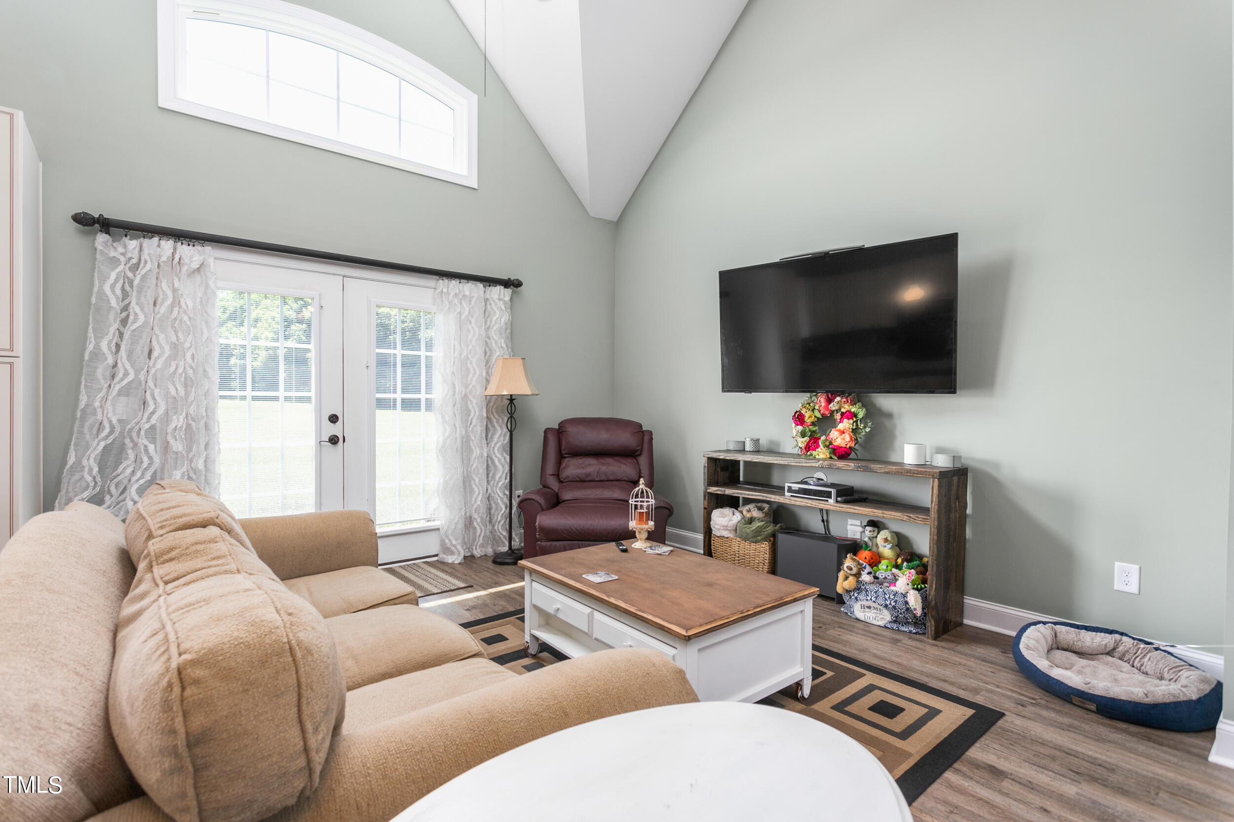 4455 Boyd Wright Road Burlington, NC 27215 - Photo 13 of 40 a living room with furniture and a flat screen tv