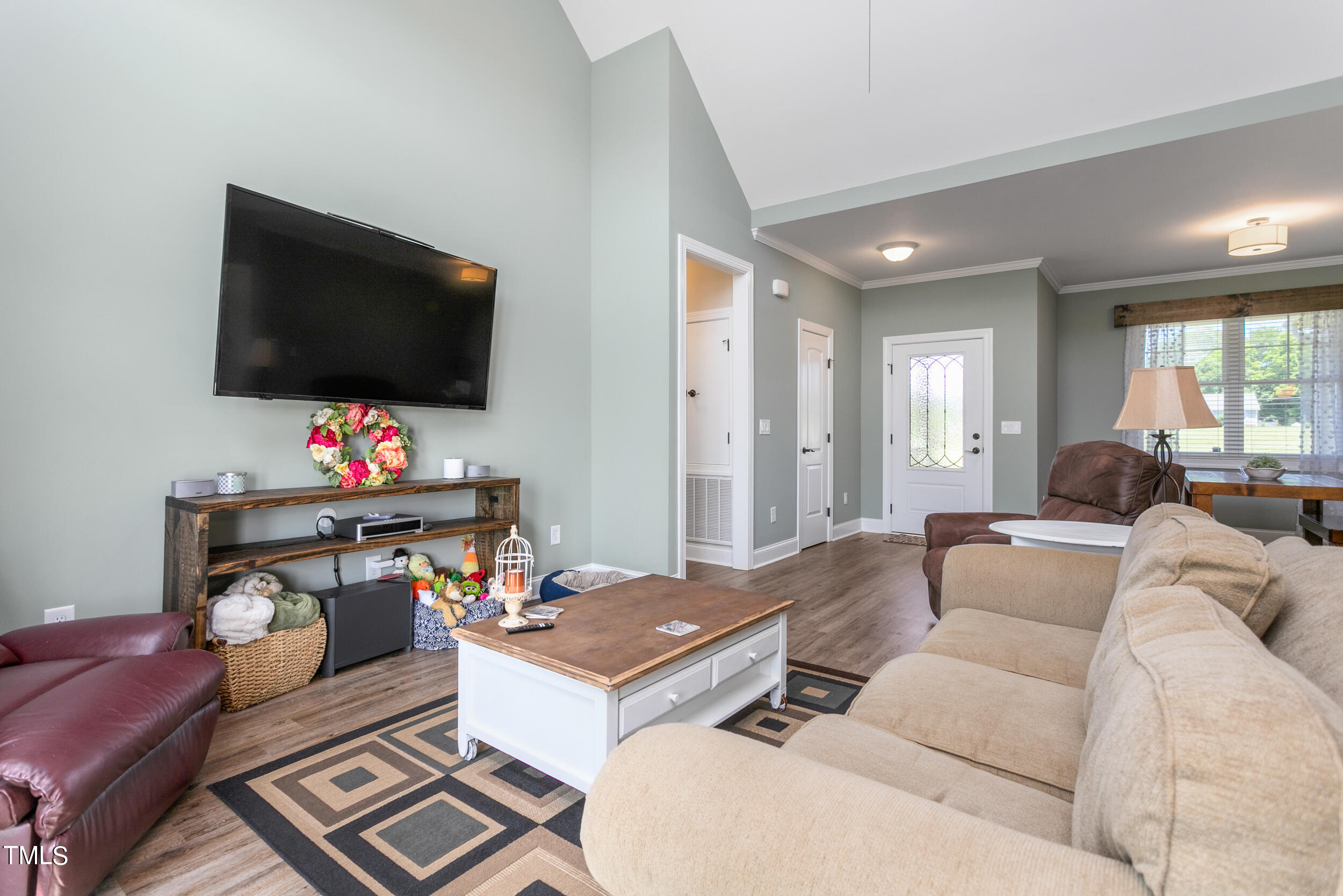 4455 Boyd Wright Road Burlington, NC 27215 - Photo 14 of 40 a living room with furniture and a flat screen tv