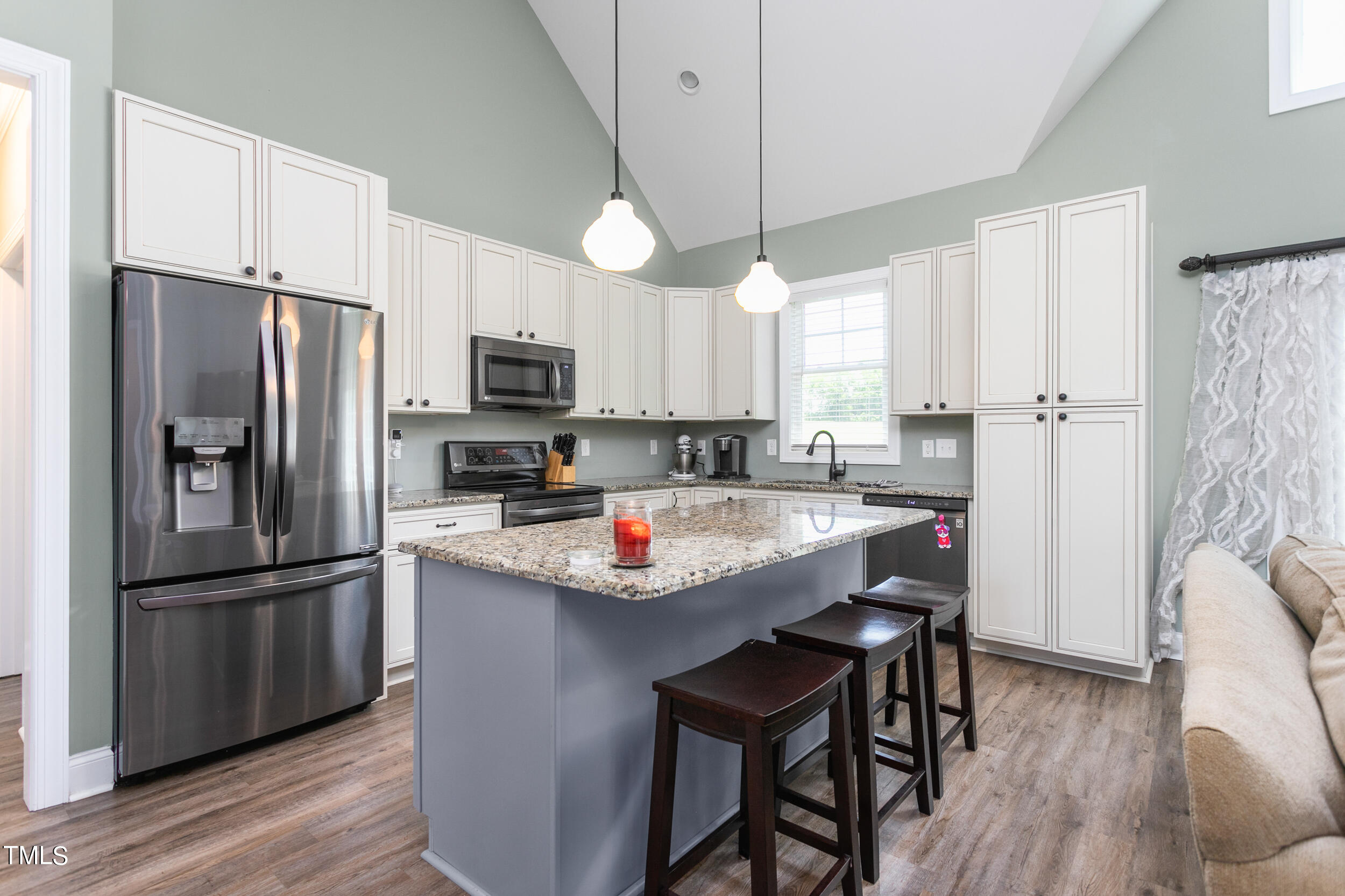 4455 Boyd Wright Road Burlington, NC 27215 - Photo 15 of 40 a kitchen with stainless steel appliances granite countertop a refrigerator a sink a stove a microwave and island