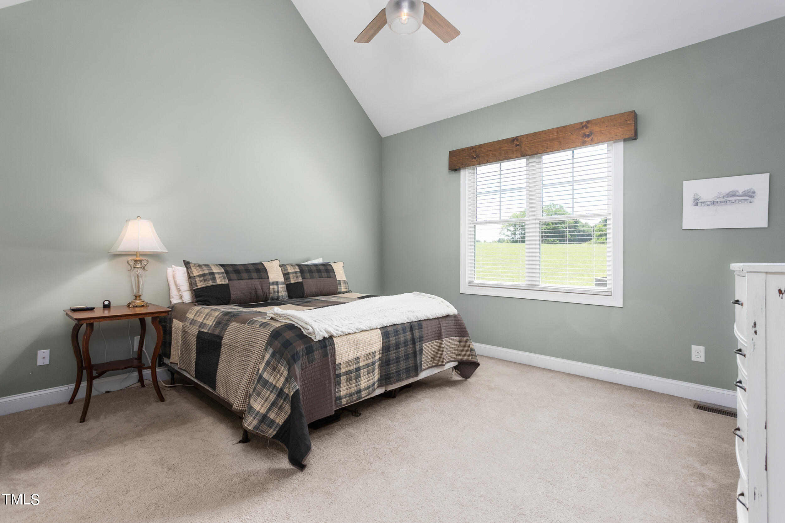 4455 Boyd Wright Road Burlington, NC 27215 - Photo 19 of 40 a spacious bedroom with a bed and window