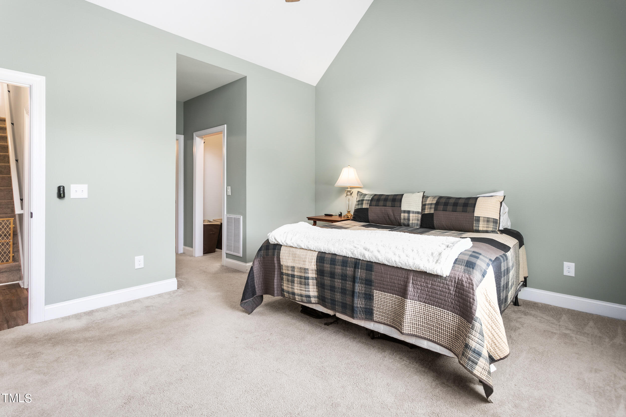4455 Boyd Wright Road Burlington, NC 27215 - Photo 20 of 40 a bed sitting in a bedroom next to a bathroom