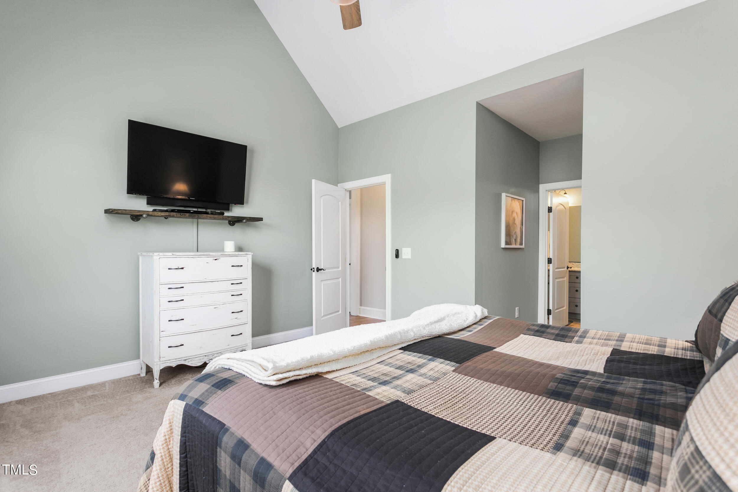 4455 Boyd Wright Road Burlington, NC 27215 - Photo 21 of 40 a bedroom with a bed and a flat screen tv