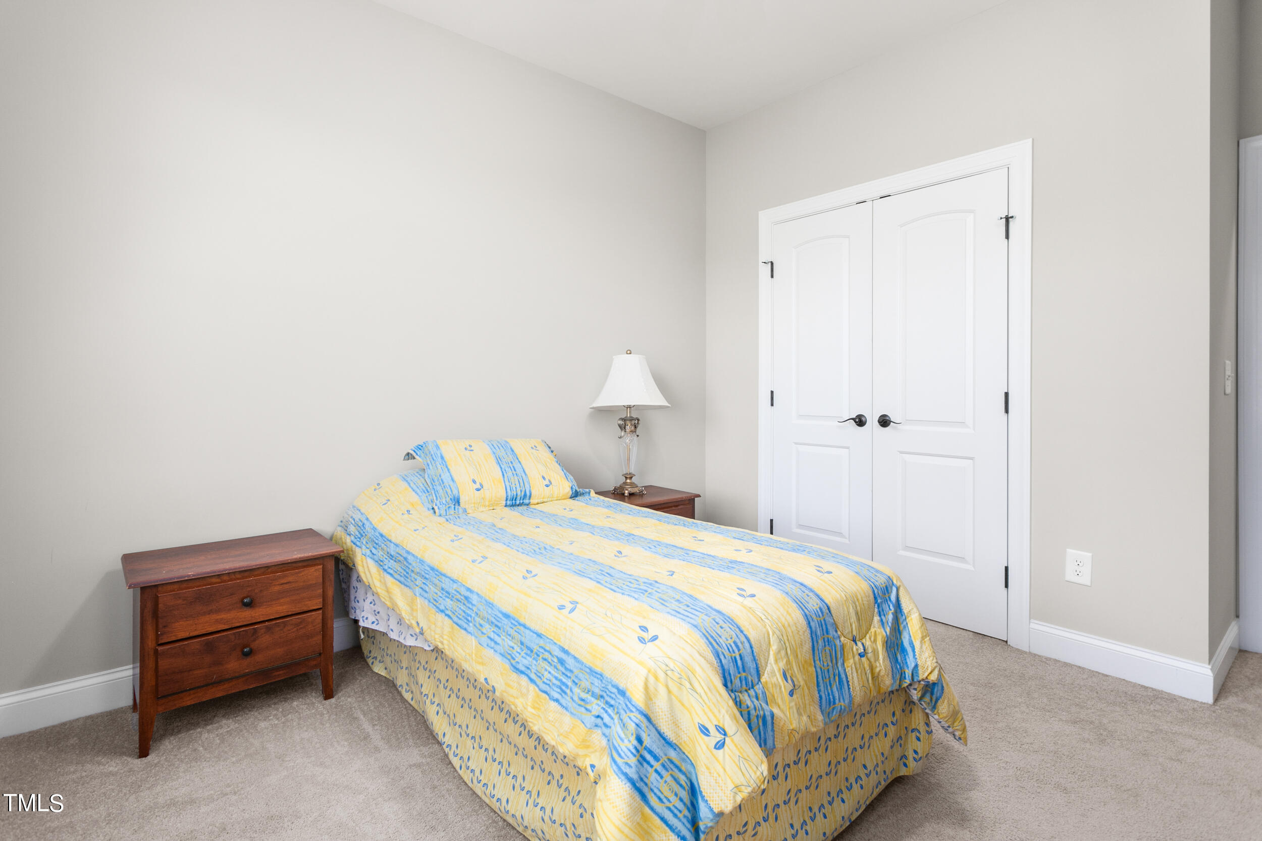 4455 Boyd Wright Road Burlington, NC 27215 - Photo 26 of 40 a bedroom with a bed and a table