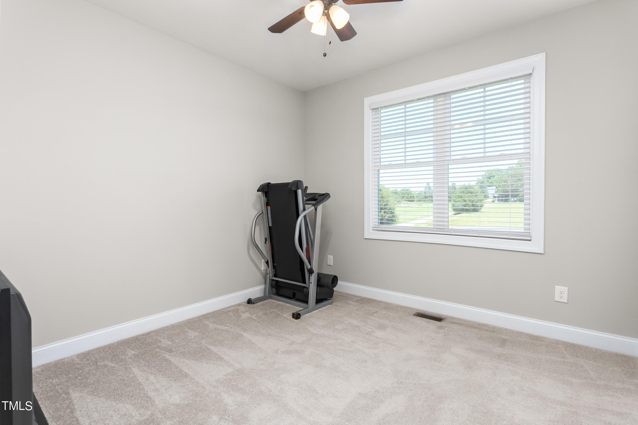 4455 Boyd Wright Road Burlington, NC 27215 - Photo 28 of 40 a view of room with window and ceiling fan