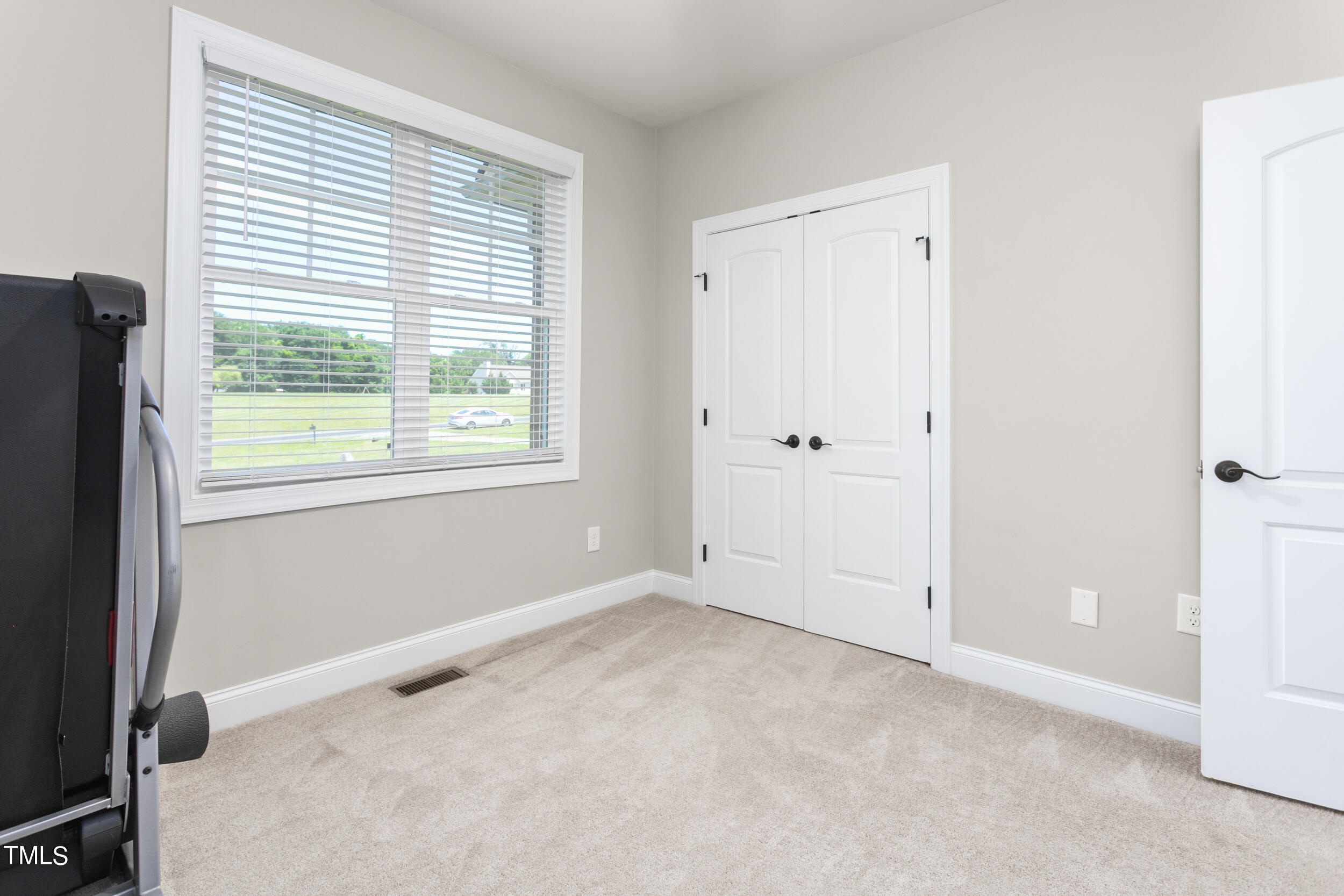 4455 Boyd Wright Road Burlington, NC 27215 - Photo 29 of 40 a view of an empty room with a window