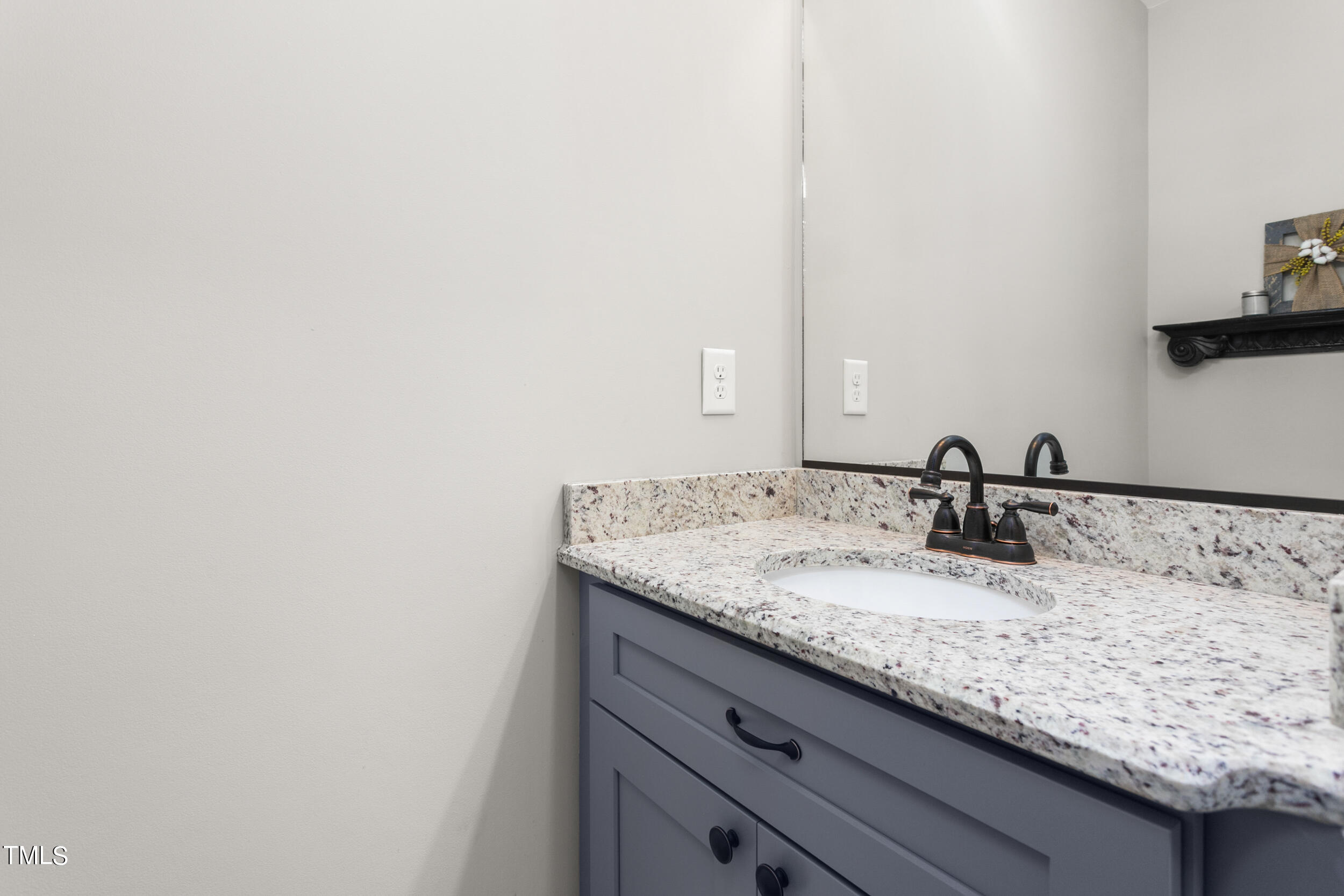 4455 Boyd Wright Road Burlington, NC 27215 - Photo 30 of 40 a bathroom with a granite countertop sink and a mirror